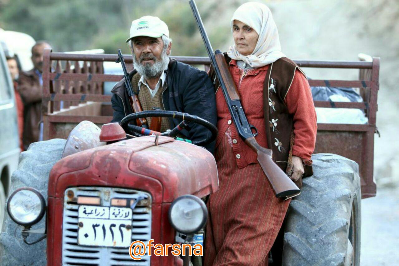 یک زوج کشاورز در لاذقیه سوریه آماده رویارویی با تروریست ها +عکس