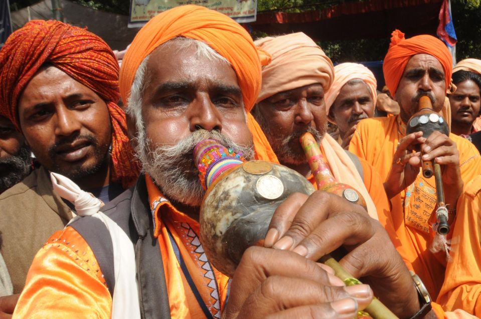 مارگیران در جریان تظاهرات علیه فقر درشهر دهلی نو در هند +عکس