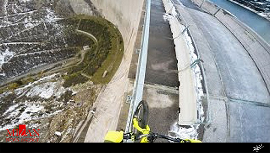 دوچرخه‌سواری روی نرده‌های یک سد در ارتفاع 198 متری + فیلم