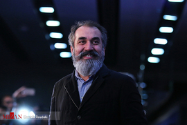 سیامک انصاری ، بازیگر ، در فرش قرمز فیلم سینمایی زهرمار