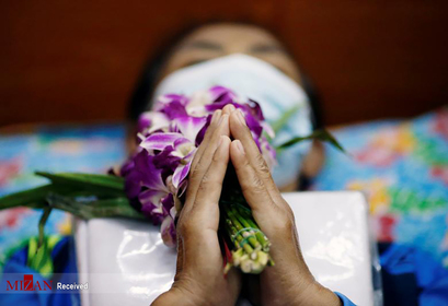 یک قربانی کرونا در تابوت در تایلند.